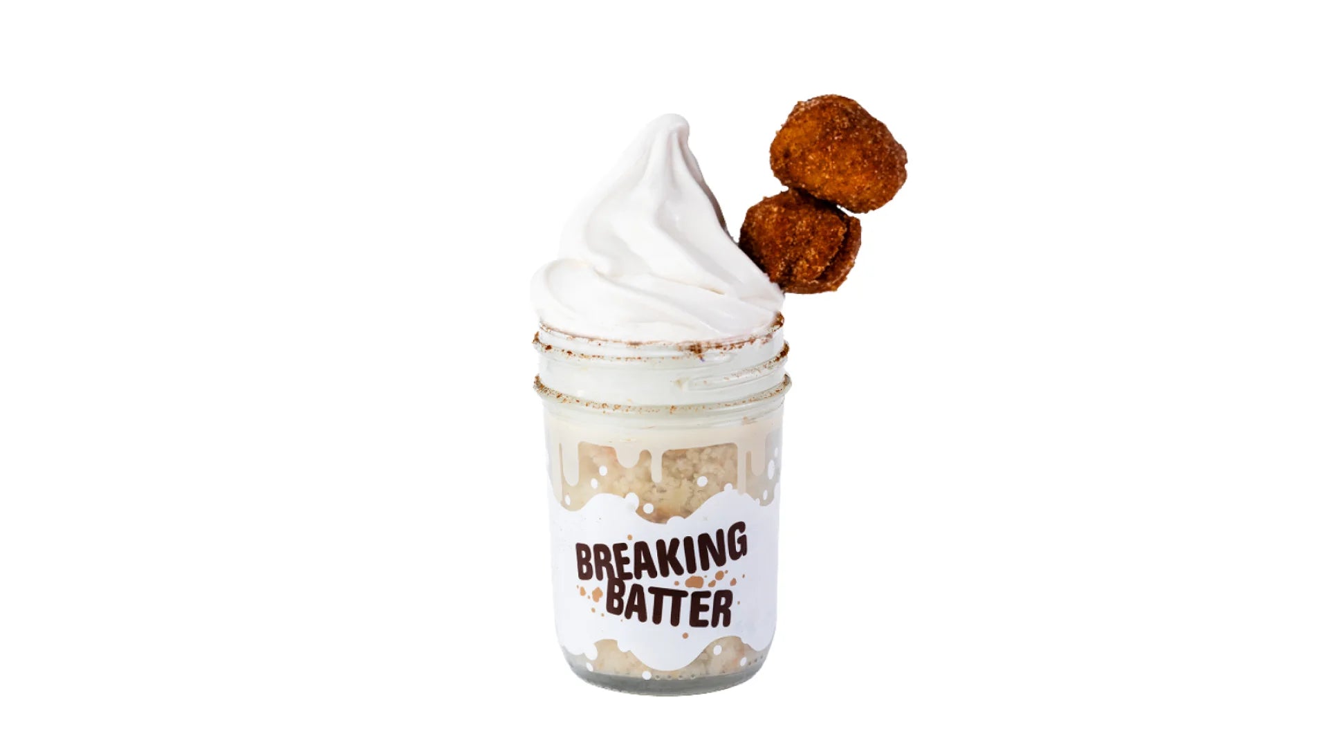 A Breaking Batter Ice Cream Cake Jar with Vanilla Tres Leches Cake, Tres Leches Frosting, Dulce De Leches Sauce, a Dusting of Cinnamon, Earl Grey Ice Cream and Churro Donut Holes.