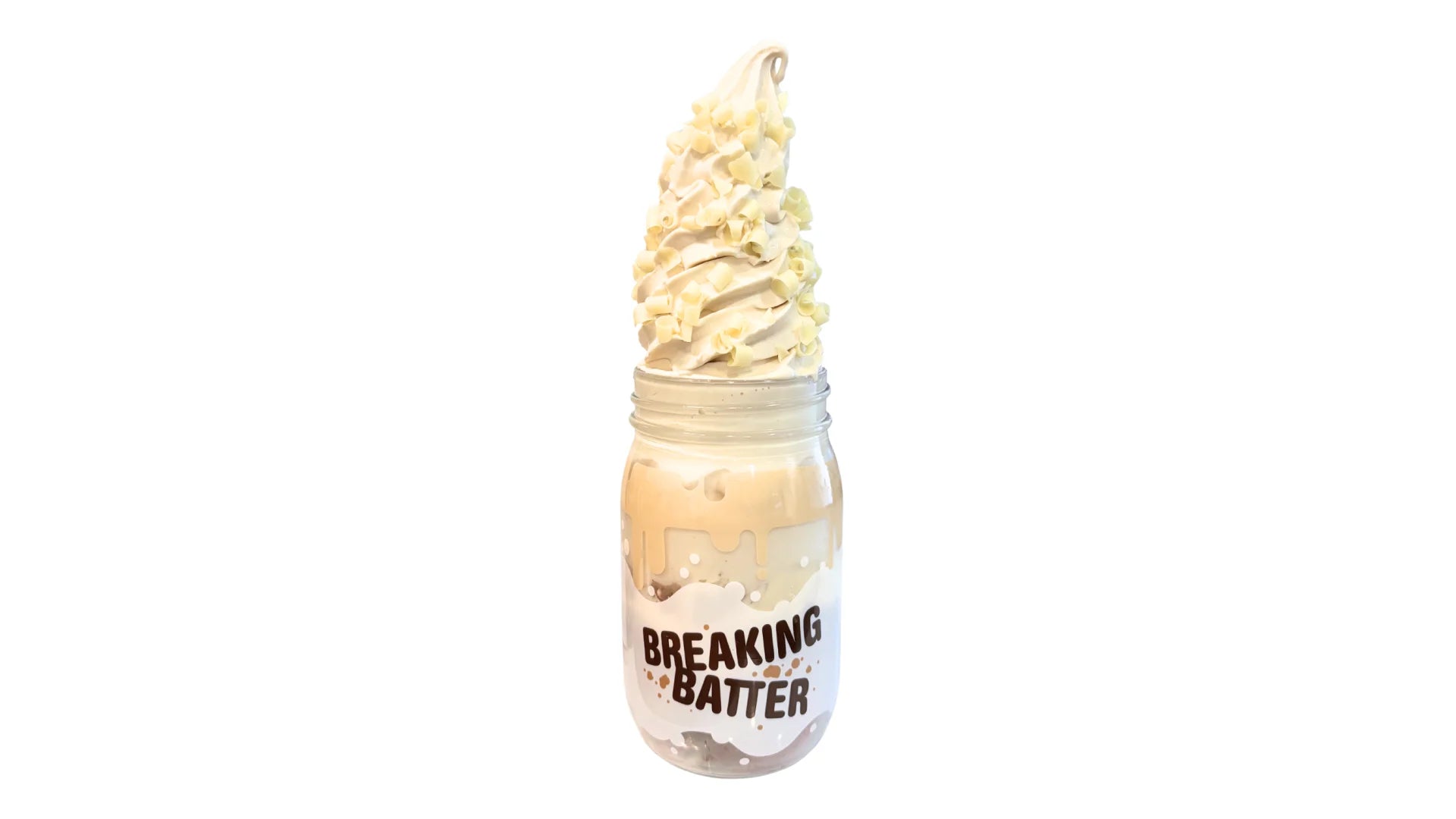 A Breaking Batter Ice Cream Cake Jar with Red Velvet Cake, Cream Cheese Frosting, White Chocolate Curls and Earl Grey Ice Cream.