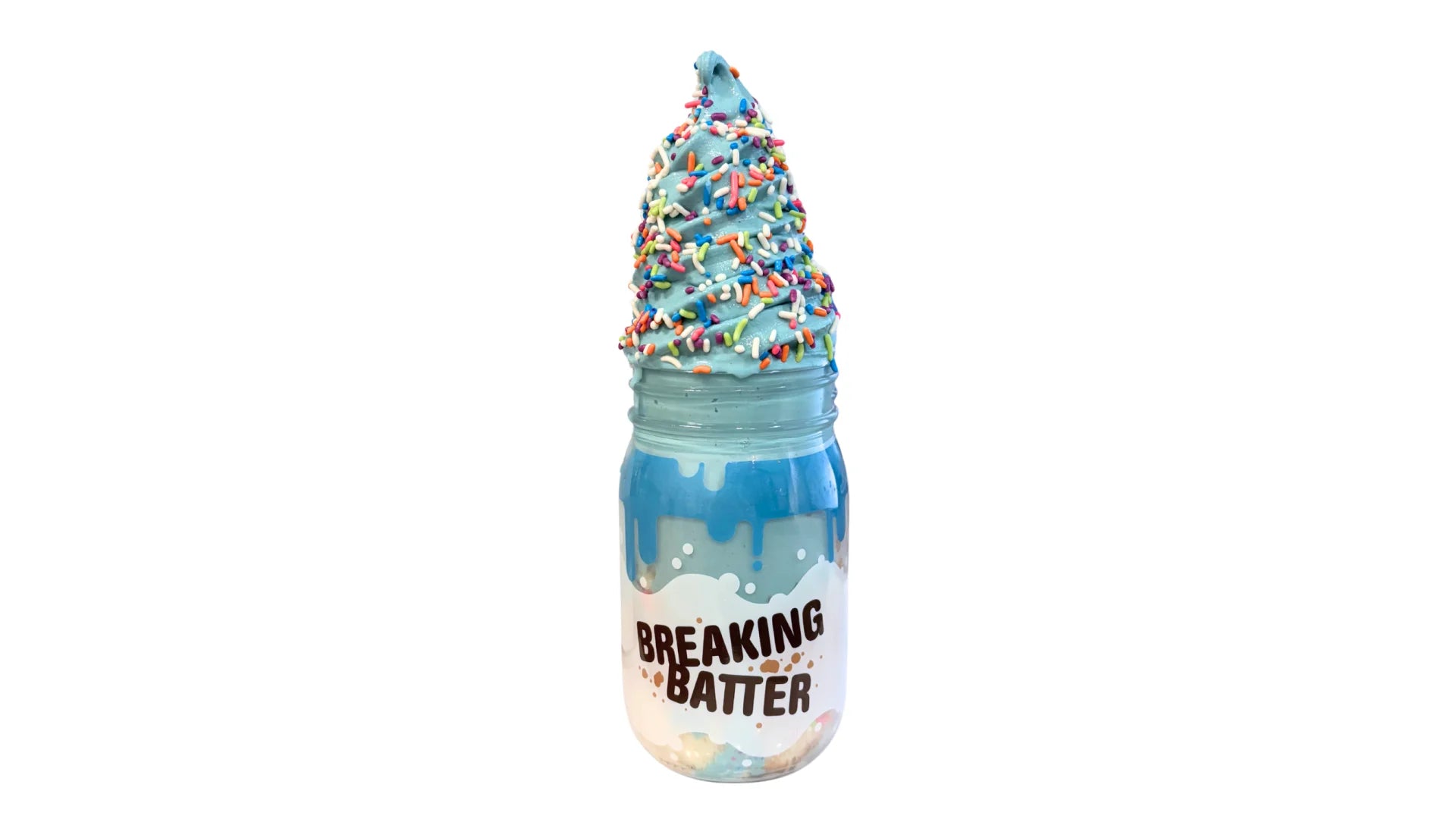 A Breaking Batter Ice Cream Cake Jar with Vanilla Cake, Cookies & Cream Frosting, Blue Vanilla Frosting,  Rainbow Sprinkles and Cookie Monster Ice Cream.