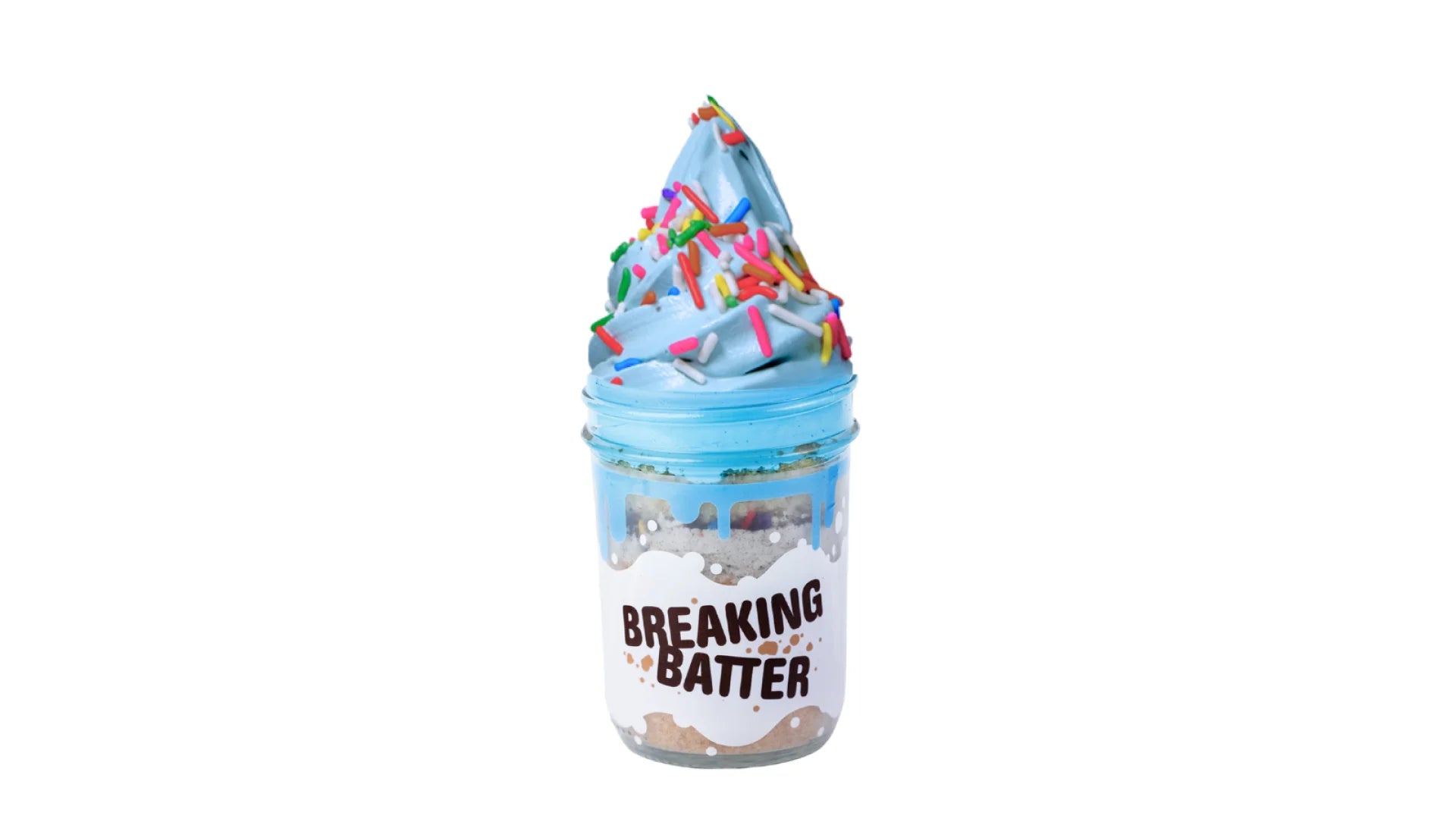 A Breaking Batter Ice Cream Cake Jar with Vanilla Cake, Cookies & Cream Frosting, Blue Vanilla Frosting,  Rainbow Sprinkles and Cookie Monster Ice Cream.