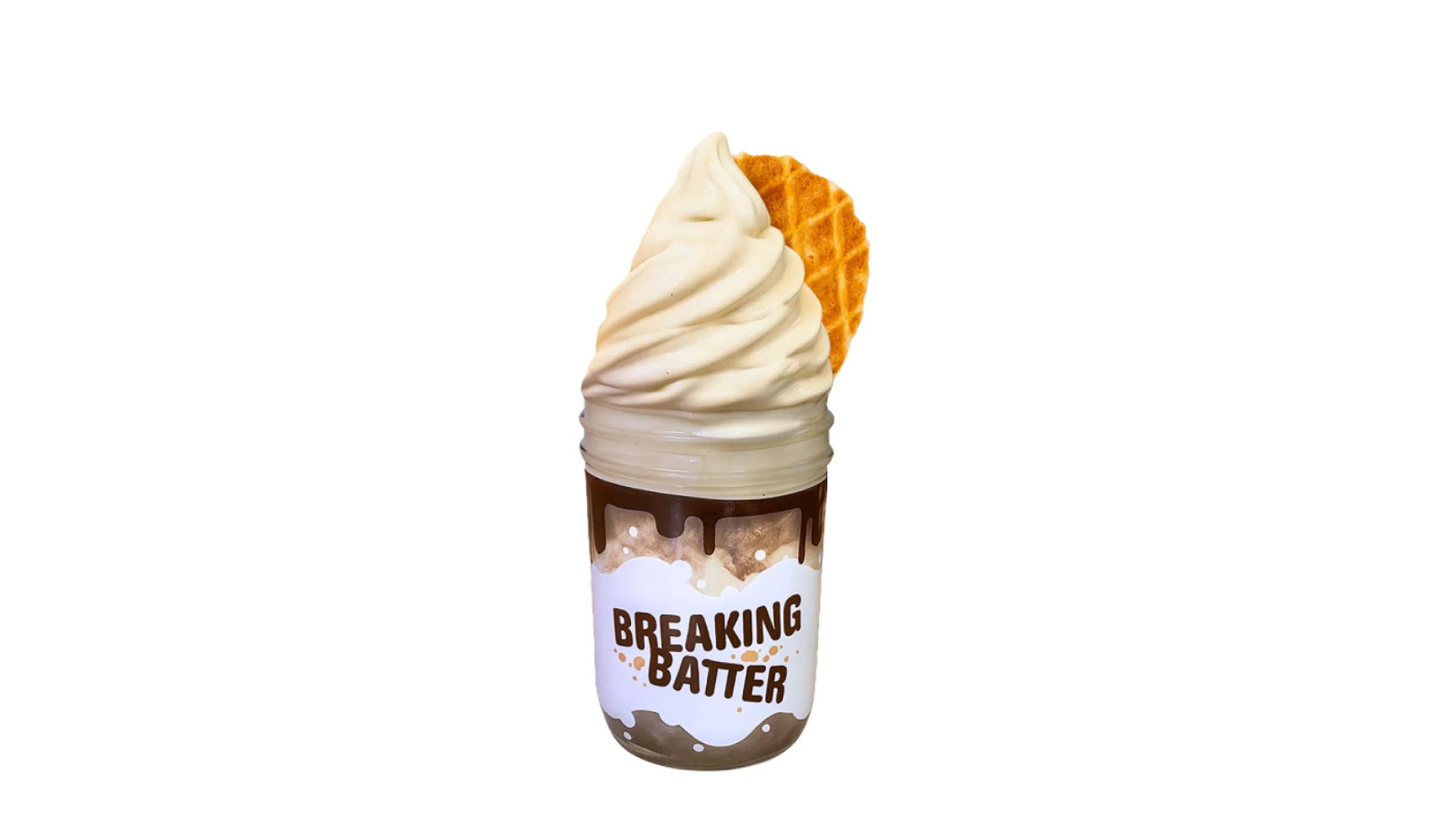 A Breaking Batter Ice Cream Cake Jar with Espresso Cake, Tiramisu Frosting, a Dusting of Cocoa Powder, Vietnamese Iced Coffee Ice Cream and a Butter Waffle Cookie.