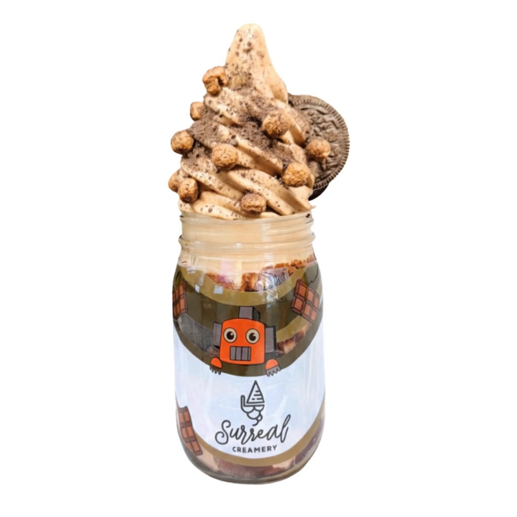 Surreal Creamery Chocolate Blackout Ice Cream Mason Jar with Chocolate Ice Cream, Chocolate Crunch, Chocolate Syrup, Cocoa Puffs, and Oreos.