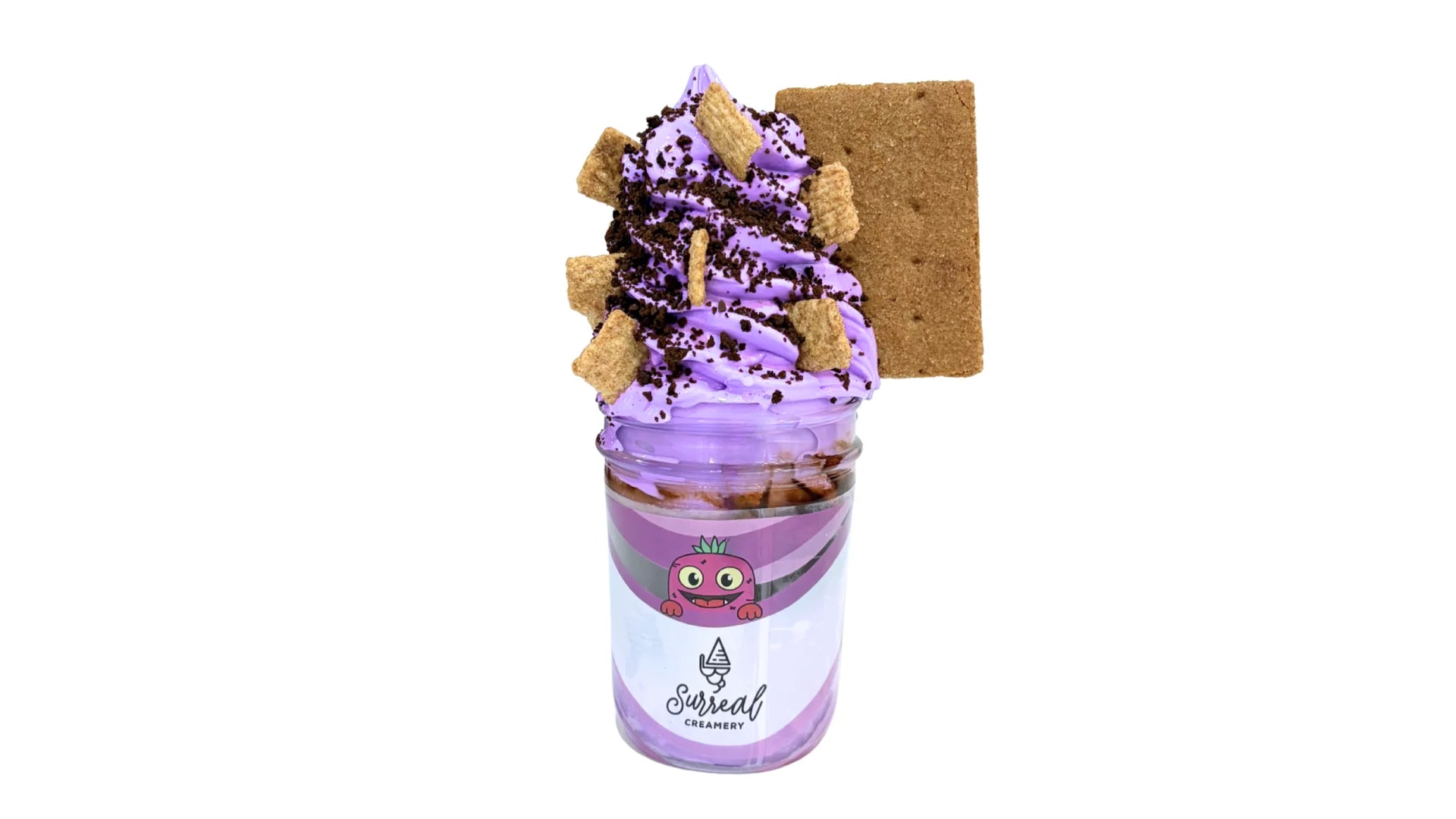 Surreal Creamery Know Your Roots Ice Cream Mason Jar with Taro Ice Cream, Cinnamon Toast Crunch, Chocolate Crunch, Chocolate Syrup, and a Cinnamon Graham Cracker.