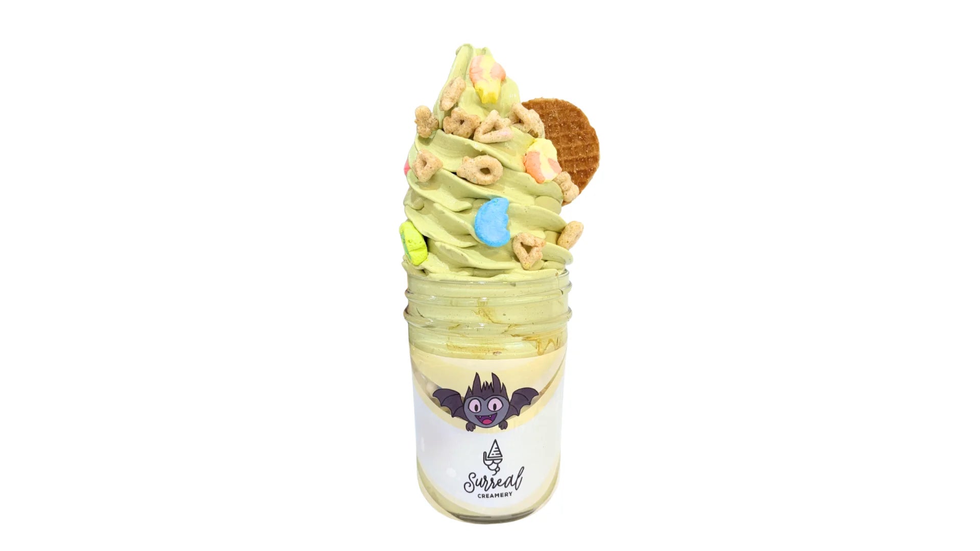 Surreal Creamery Matcha Made In Heaven Ice Cream Mason Jar with Matcha Ice Cream, Caramel Syrup, Lucky Charms, and Caramel Cookies.