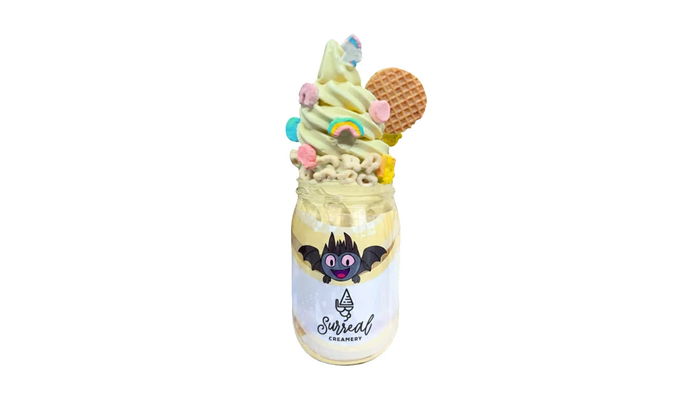 Surreal Creamery Matcha Made In Heaven Ice Cream Mason Jar with Matcha Ice Cream, Caramel Syrup, Lucky Charms, and Caramel Cookies.