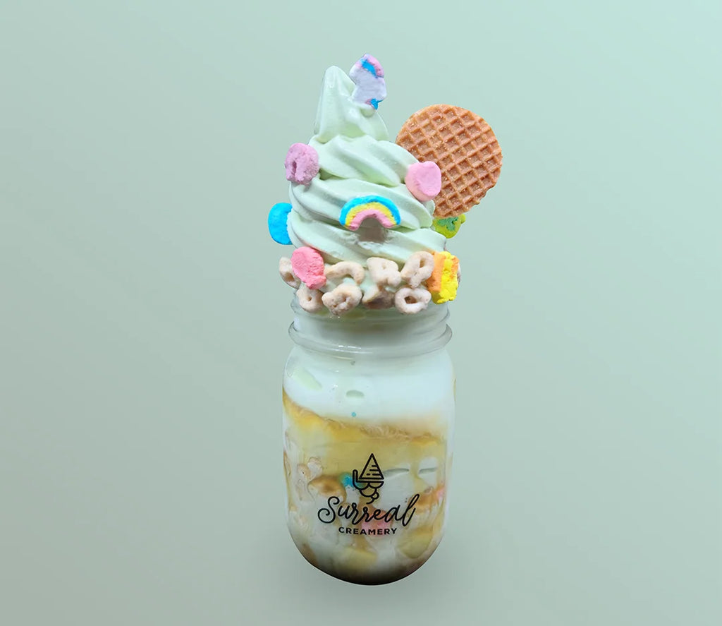 Surreal Creamery Matcha Made In Heaven Ice Cream Mason Jar with Matcha Ice Cream, Caramel Syrup, Lucky Charms, and Caramel Cookies.