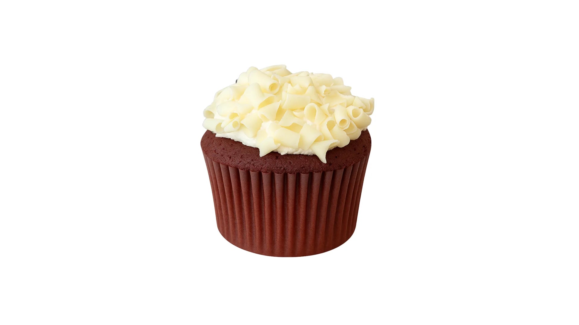 A Red Velvet Cupcake Topped with Cream Cheese Frosting and White Chocolate Curls.