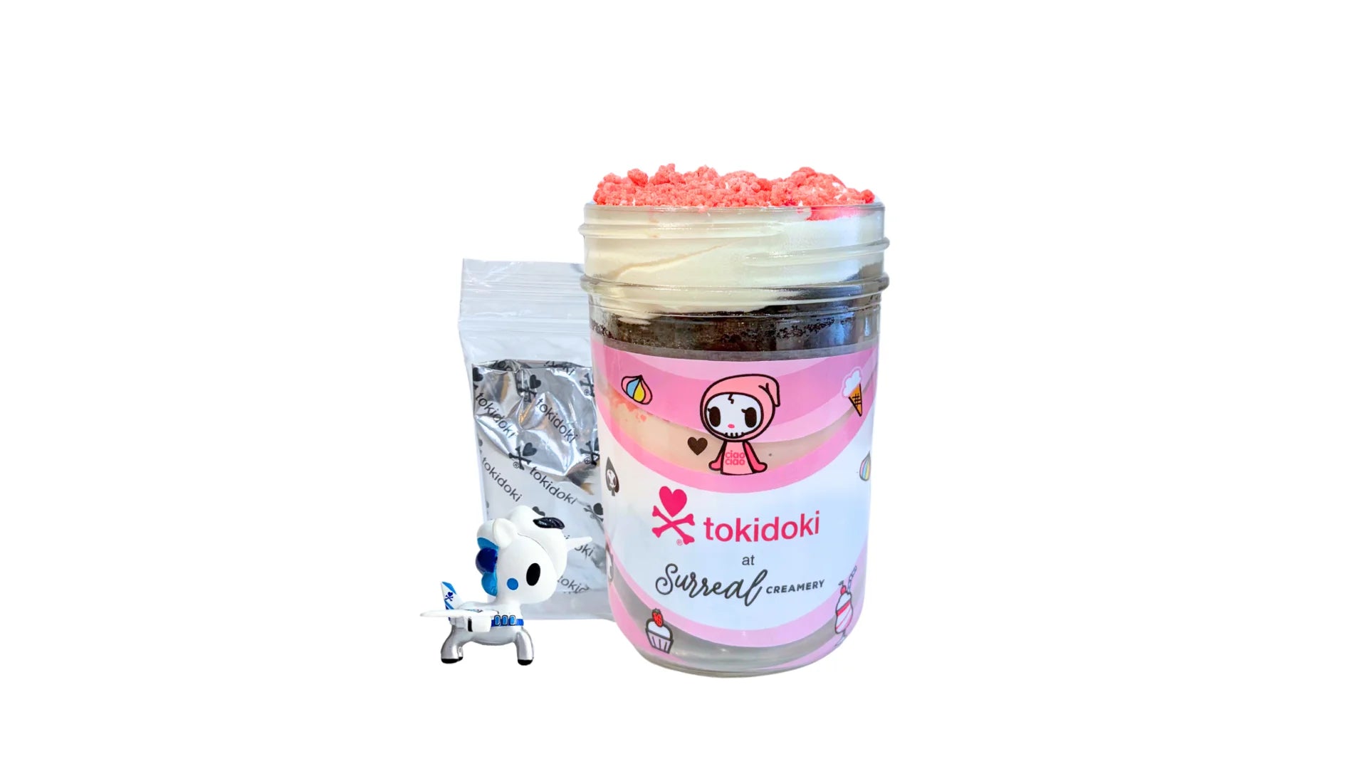 A tokidoki inspired Breaking Batter Cake Jar with Chocolate Cake, Strawberry & Marshmallow Whipped Frosting and Strawberry Crunch. Served in a limited-edition mason jar and paired with one 1" tokidoki mystery collectible.