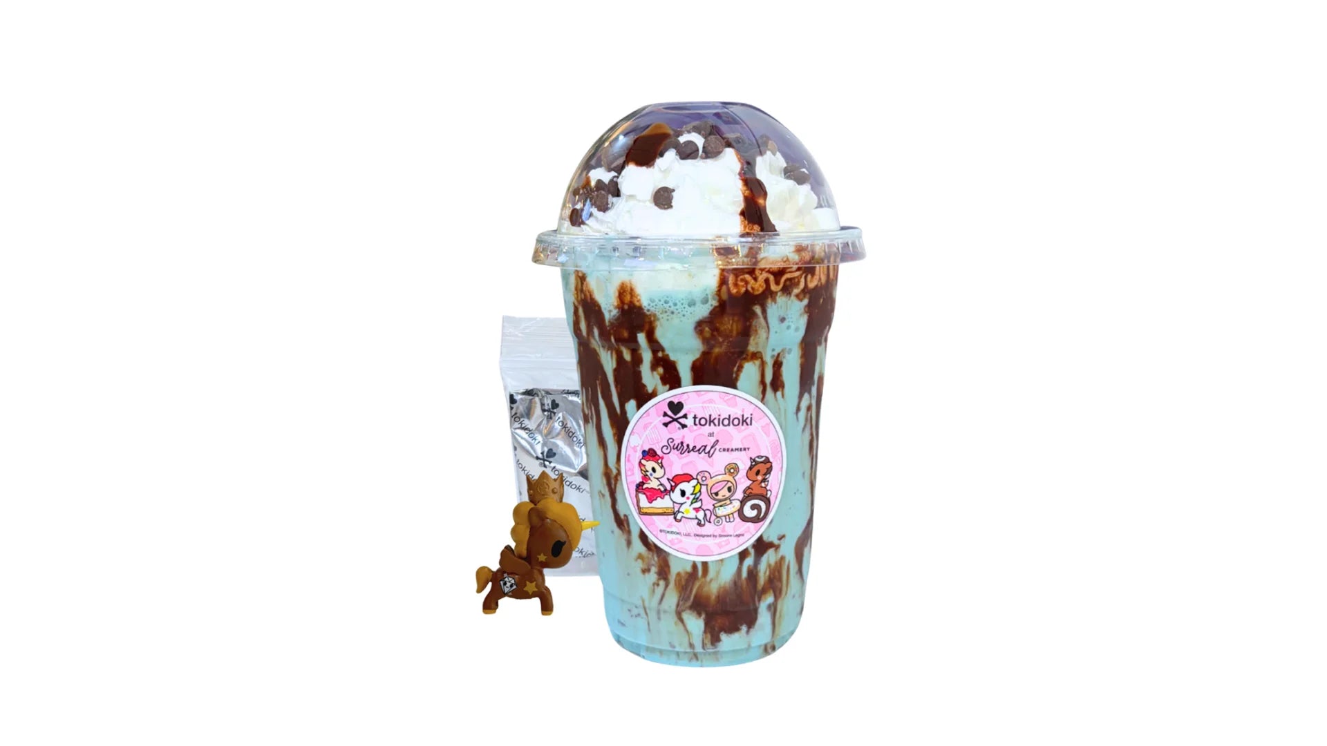 A tokidoki inspired Milkshake with Monster Cookie Ice Cream, Chocolate Syrup, Whipped Cream, Chocolate Syrup and Chocolate Chips. Comes with one 1" tokidoki mystery collectible.