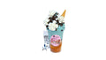 A tokidoki inspired Breaking Batter Cake Cup with Vanilla Cake, Cookies and Cream & Blue Vanilla Frosting, Chocolate Chips and Whipped Cream. Comes with one 1" tokidoki mystery collectible.