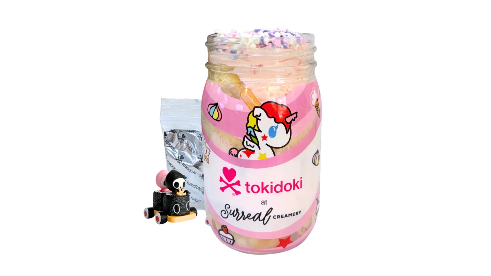 A tokidoki inspired Breaking Batter Cake Jar with Vanilla Cake, Strawberry Frosting and Starry Sprinkles. Served in a limited-edition mason jar and paired with one 1" tokidoki mystery collectible.