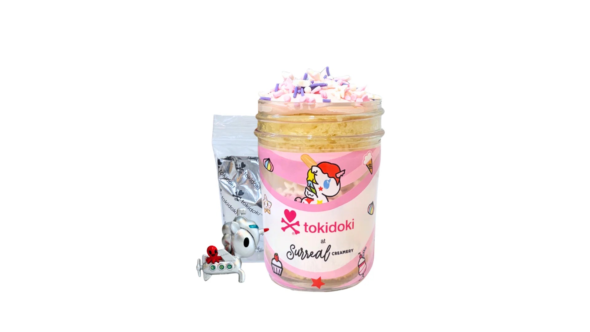 A tokidoki inspired Breaking Batter Cake Jar with Vanilla Cake, Strawberry Frosting and Starry Sprinkles. Served in a limited-edition mason jar and paired with one 1" tokidoki mystery collectible.