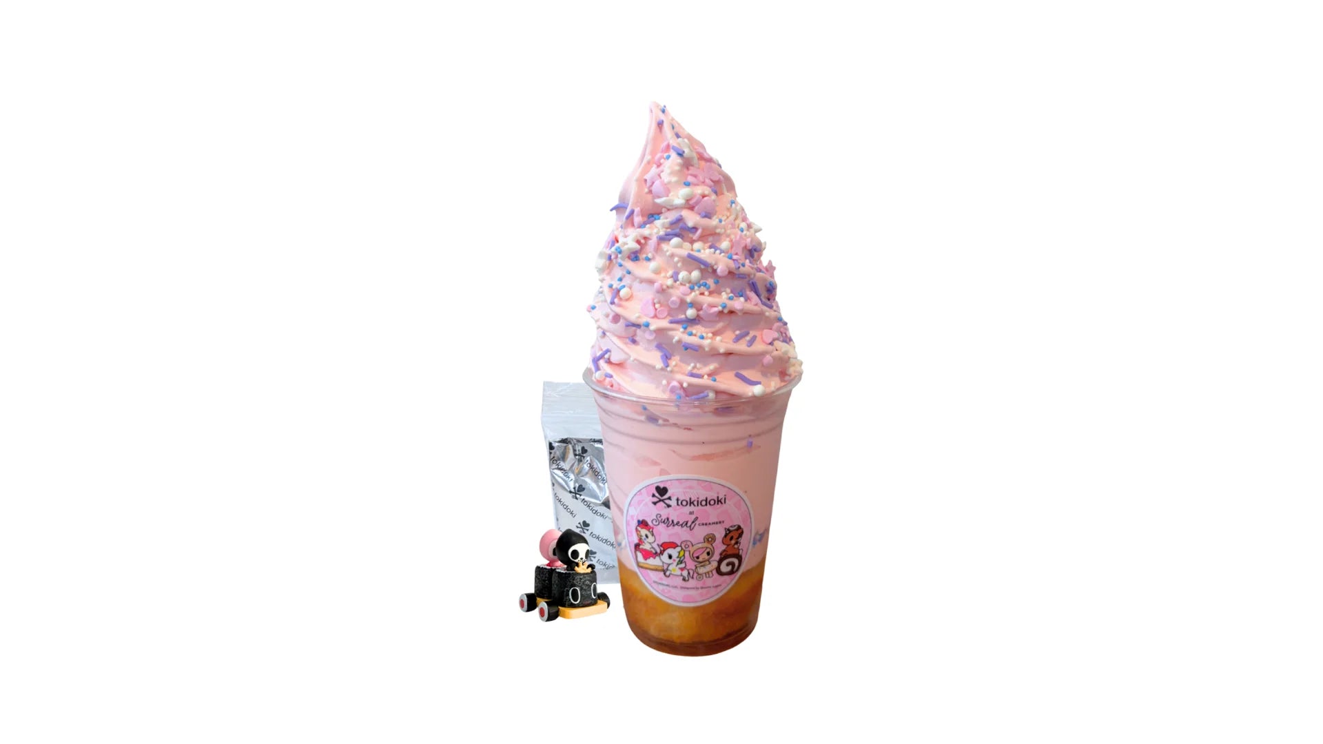 A tokidoki inspired Breaking Batter Cake Cup with Vanilla Cake, Strawberry Frosting and Starry Sprinkles. Comes with one 1" tokidoki mystery collectible.