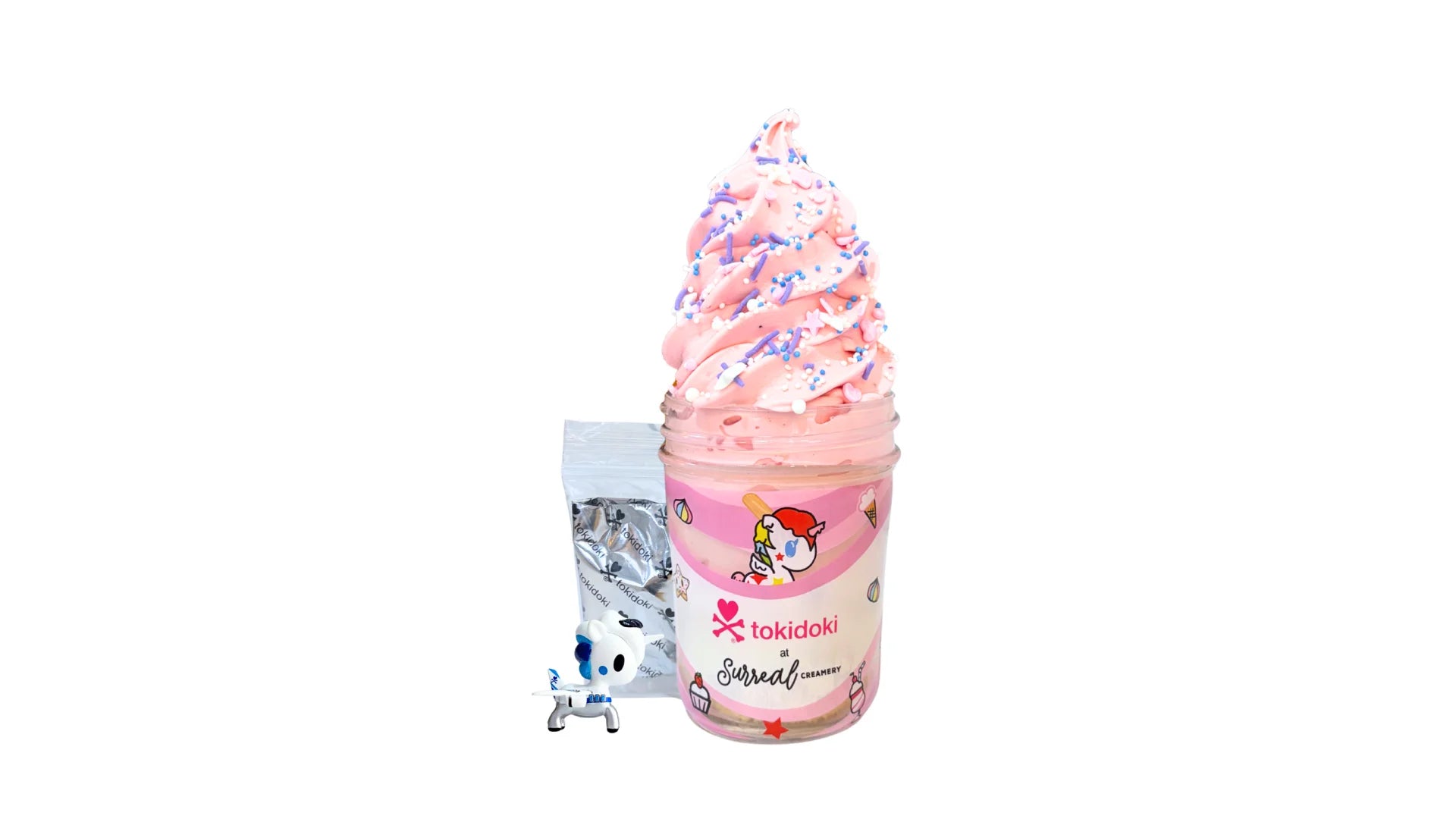 A tokidoki inspired Breaking Batter Ice Cream Cake Jar with Vanilla Cake, Strawberry Frosting, Starry Sprinkles and Strawberry Ice Cream. Served in a limited-edition mason jar and paired with one 1" tokidoki mystery collectible.